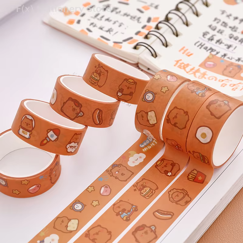 These stickers, along with five rolls of hand-drawn, cartoon capybara washi tape, form part of a delightful collage planner washi tape set