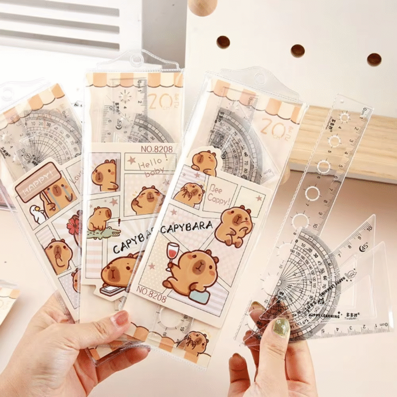 Examine this adorable cartoon straight triangle ruler for dividing, drafting, and math drawing. Each set contains four pieces, and these rulers belong to the Set of Clear Capybara Rulers - Image 3