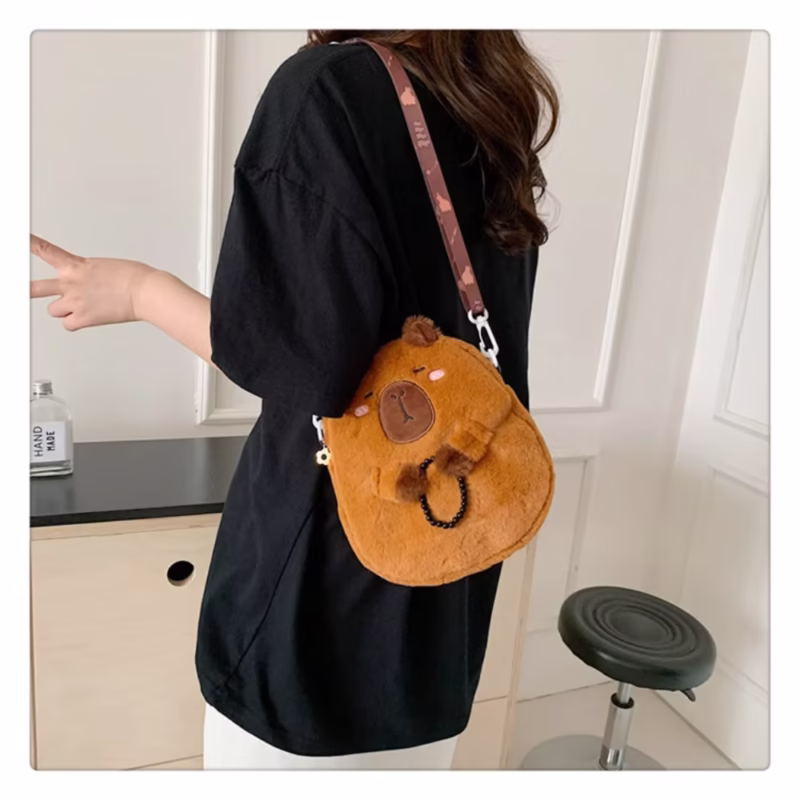 This capybara shoulder plush bag is cartoon themed which fits students especially because it is filled and accompanied by cute and functional bags - Image 4