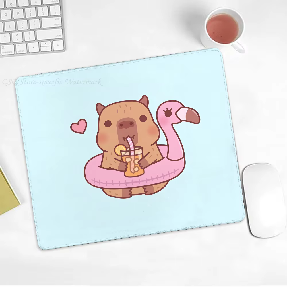 One cute capybara floormat and lock-edge mousepad for gamers which is small in size alongpadd with a rectangle non slip rubber desk pad. - Image 3