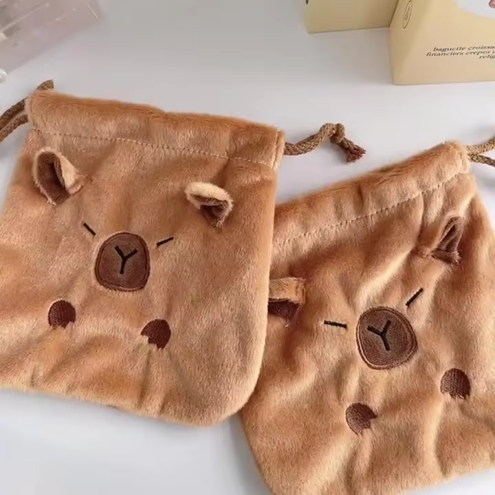 This cute Kapibala student stationery case is multifunctional and comes with a plush bunch and a pocket and has a cute capybara on the front. It is perfect for storage.