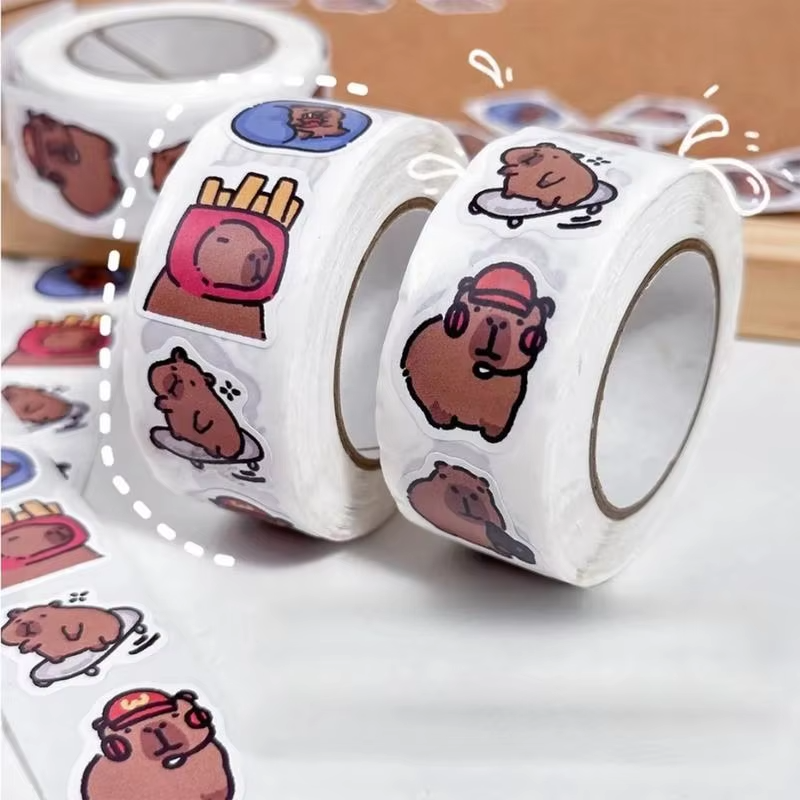Sticker roll for self-expression and adornment. Each roll is loaded with 500 self-adhesive, waterproof and protected stickers portraying theme Capybaras in brazenly versatile motifs perfectly crafted for your personalized laptop