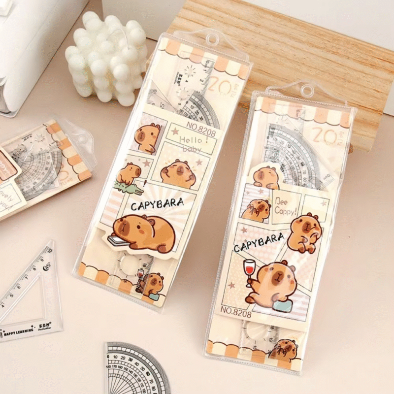 Examine this adorable cartoon straight triangle ruler for dividing, drafting, and math drawing. Each set contains four pieces, and these rulers belong to the Set of Clear Capybara Rulers - Image 2