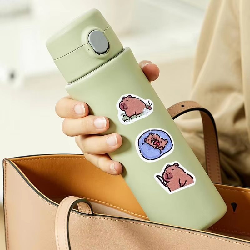 Sticker roll for self-expression and adornment. Each roll is loaded with 500 self-adhesive, waterproof and protected stickers portraying theme Capybaras in brazenly versatile motifs perfectly crafted for your personalized laptop - Image 5